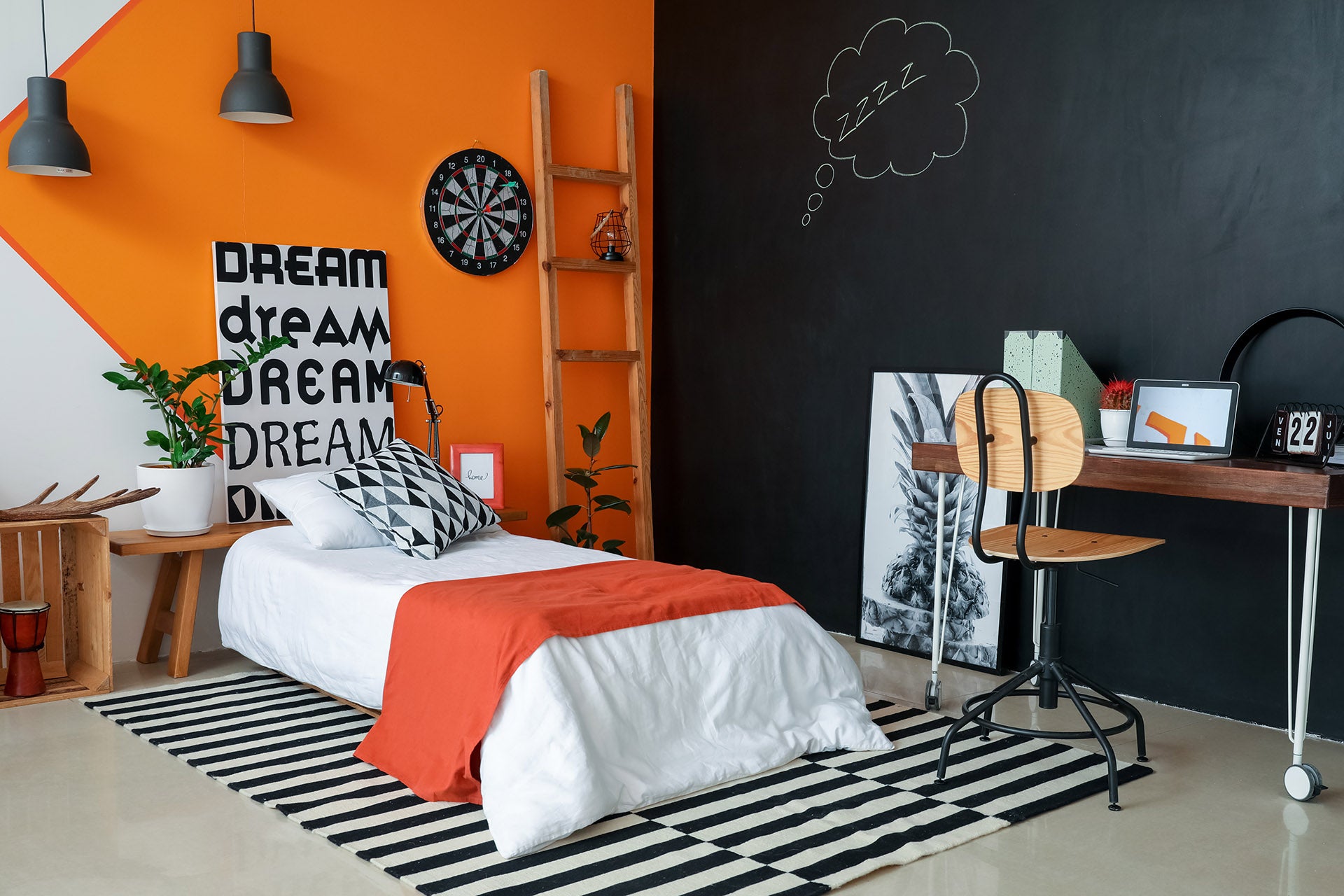 White single bed in childs room with desk and vibrate wall colours