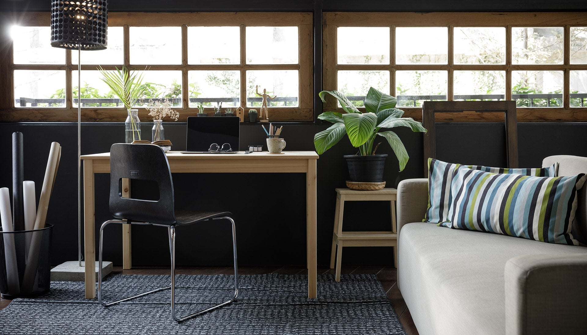 Modern wooden office desk and black chair