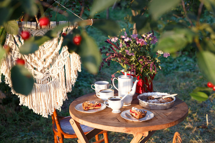 Small round garden table with breakfast on