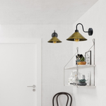 Brushed Brass Wall Light Cone Shade Swan Neck Sconce Home on white wall above a shelf with decor