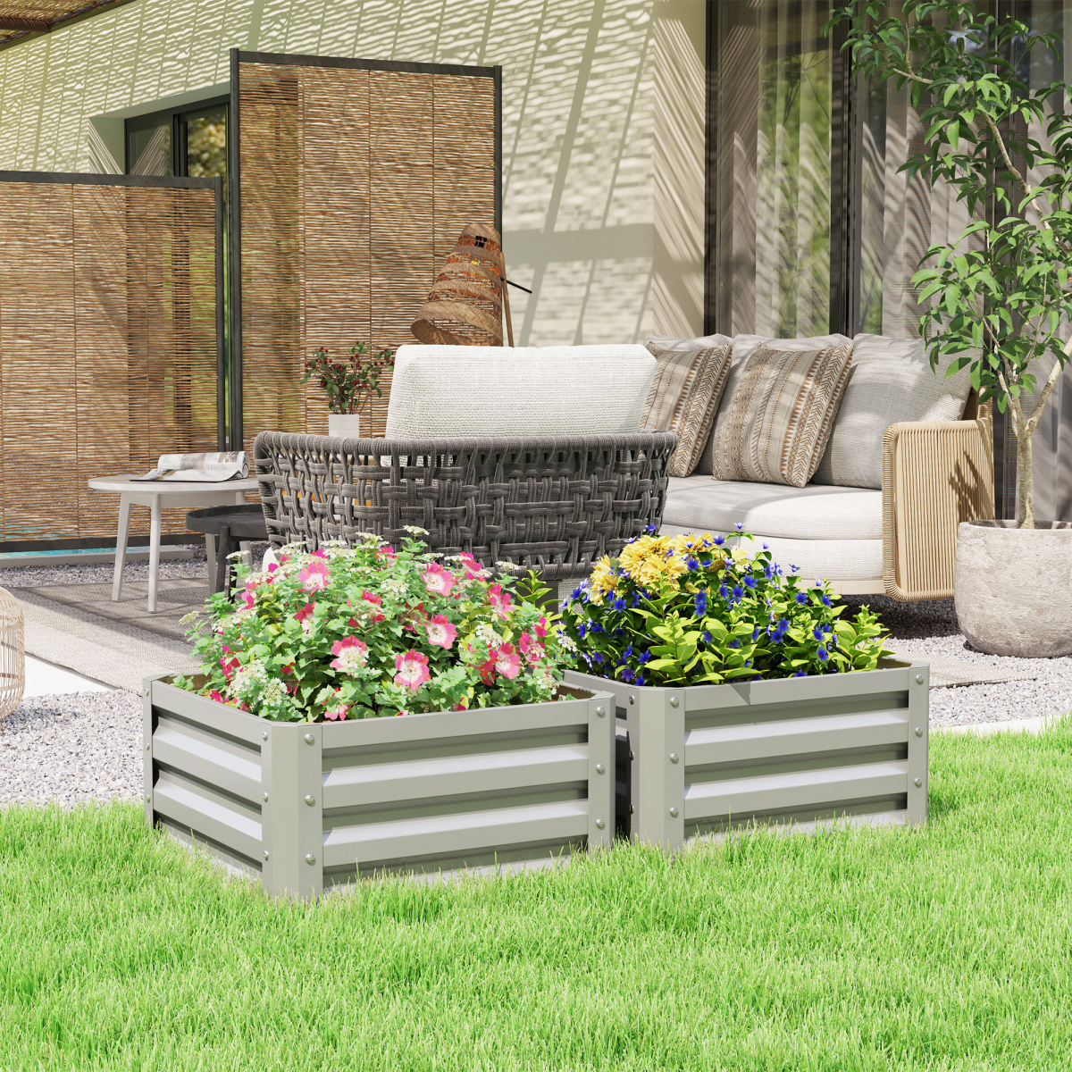Outsunny two-pack galvanised steel raised garden beds with flowers on a lawn beside a modern patio seating area.