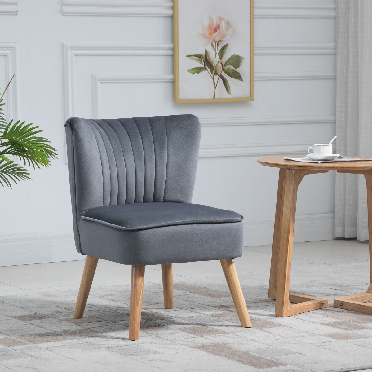 HOMCOM Velvet Accent Tub Chair Soft Upholstery Living Room in grey velvet with wooden legs beside a round table.