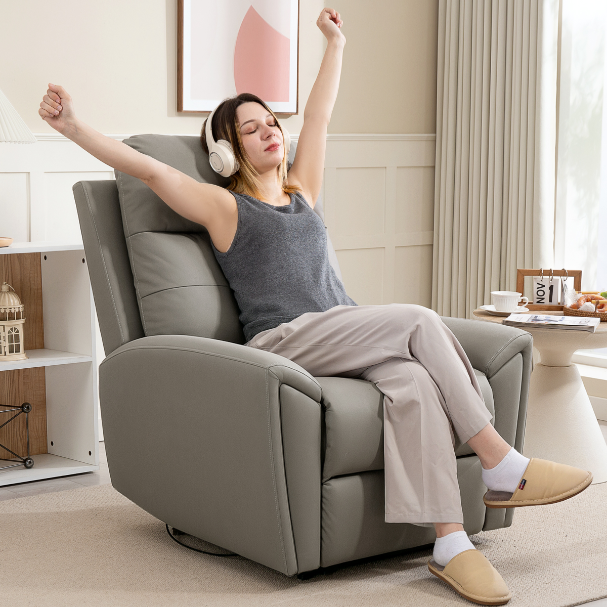HOMCOM Full Size Manual Recliner Armchair For Living Room - person relaxing in a grey recliner with headphones.