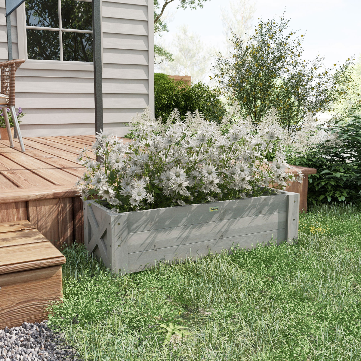 Outsunny raised bed planter 100x36.5x36 cm filled with white daisies beside a wooden deck.