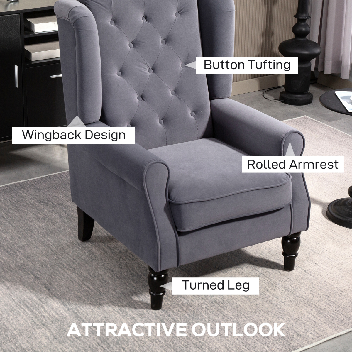 Charcoal velvet accent armchair with wingback, tufted back, piped arms, rolled armrests, turned legs, wooden frame.