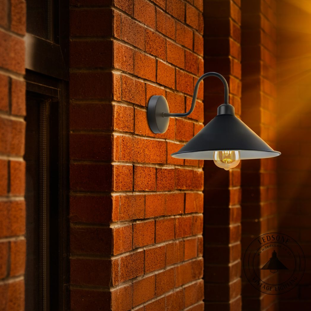 Home Symphony Premium Wall Sconce Cone Shade Swan Neck Dimmable Home on brick wall with warm downward light.
