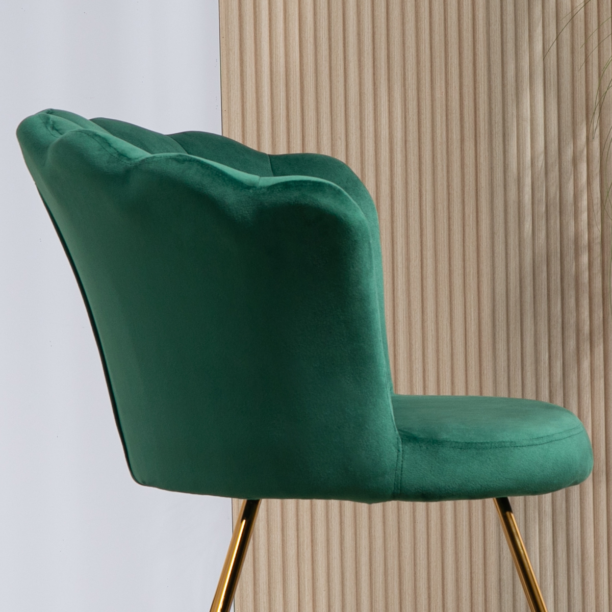 HOMCOM green velvet lotus-backrest accent chair with gold legs in a living room.