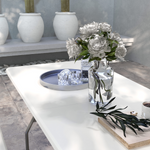 Stylish setting featuring the Outsunny Folding Garden Table with Large HDPE Top and Powder-Coated Steel Frame for Outdoor Entertaining.