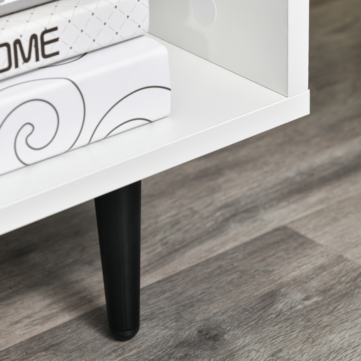 HOMCOM 120cm TV stand in white with black tapered leg and cable-hole storage.