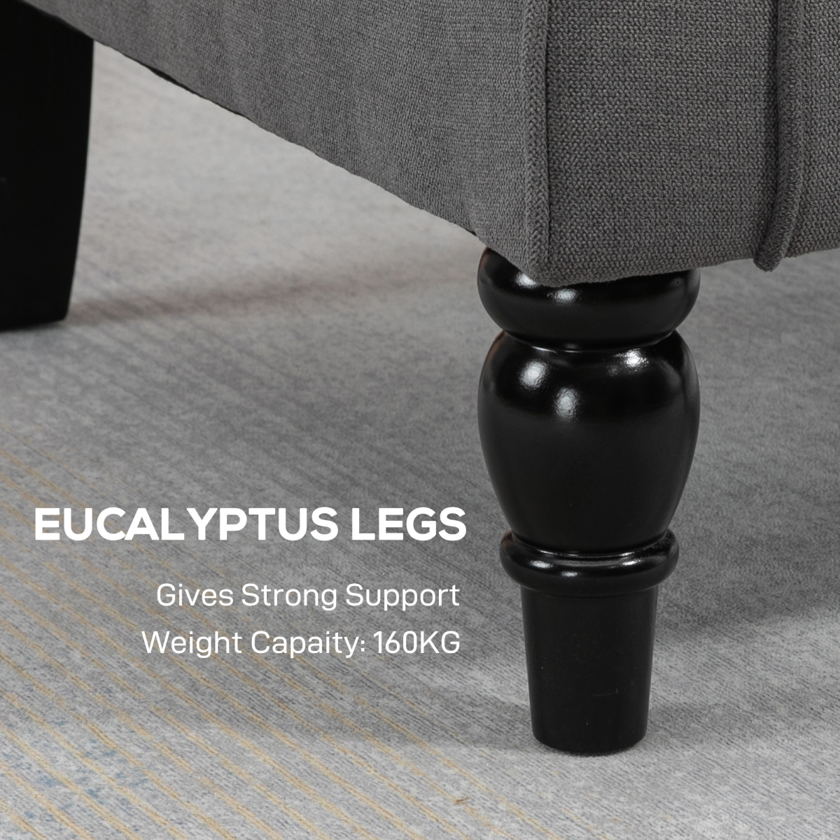 Accent armchair with tufted wingback in grey fabric, supported by eucalyptus legs.