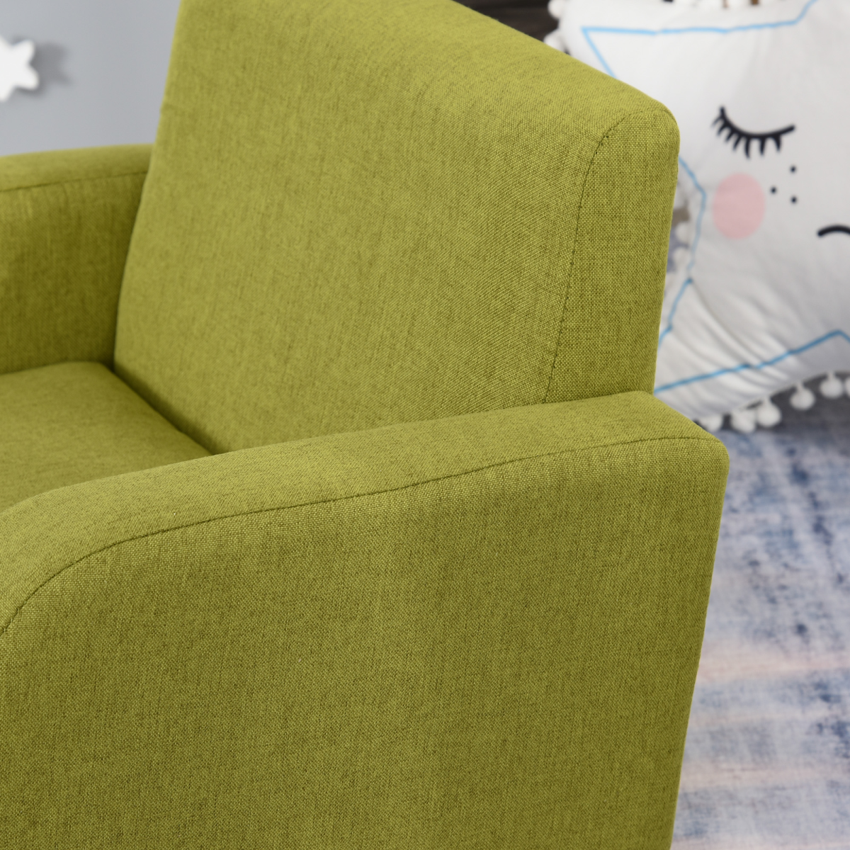 Green child armchair with wood frame and padded seat for kids.