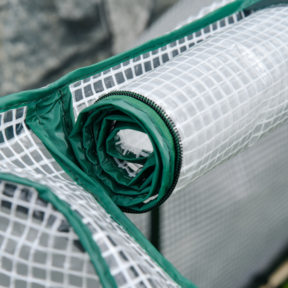 Rolled PE greenhouse cover with green trim on white grid mesh for a 4ft garden bed planter.