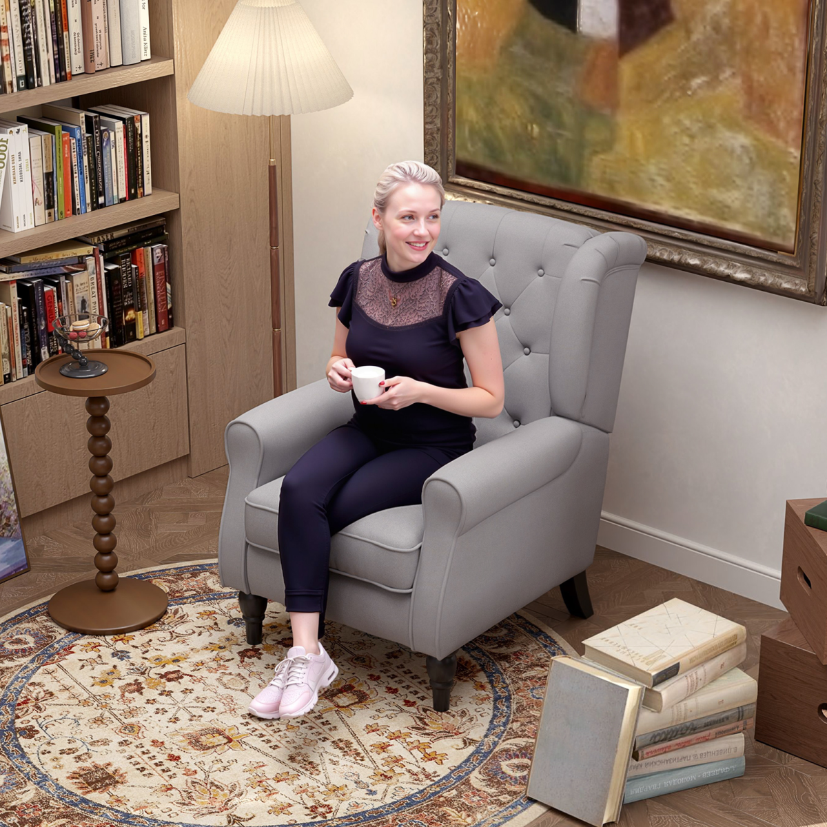 Retro wingback accent chair with a medium wood frame in light gray, featuring a woman seated in a library living room.