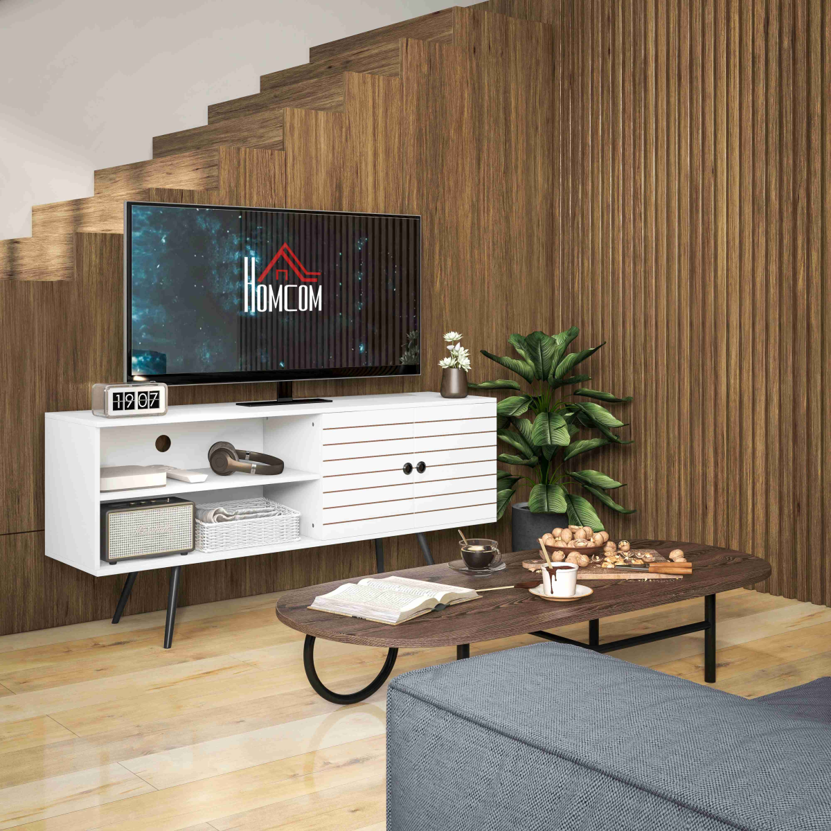HOMCOM 65-inch white TV unit with doors and shelves in a modern living room with a coffee table and plant.
