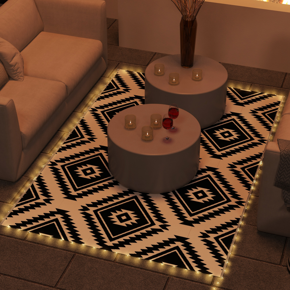 Outsunny 182x274 cm waterproof outdoor rug with USB LED border lights on a black-and-white geometric patio rug.
