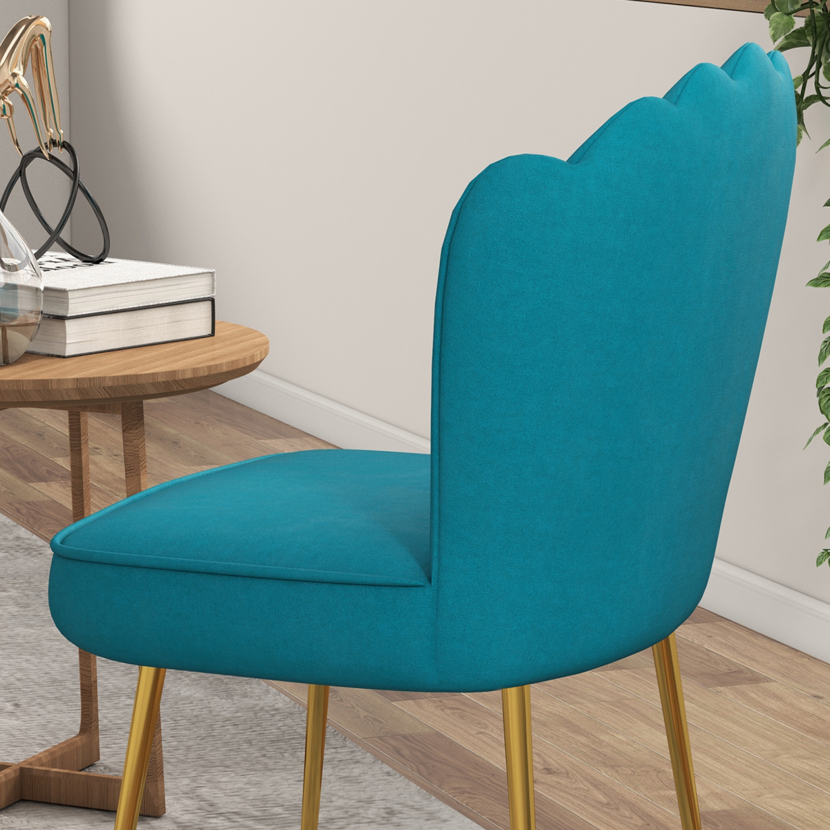 HOMCOM teal velvet shell accent chair with gold metal legs in a living room beside a round wooden table.