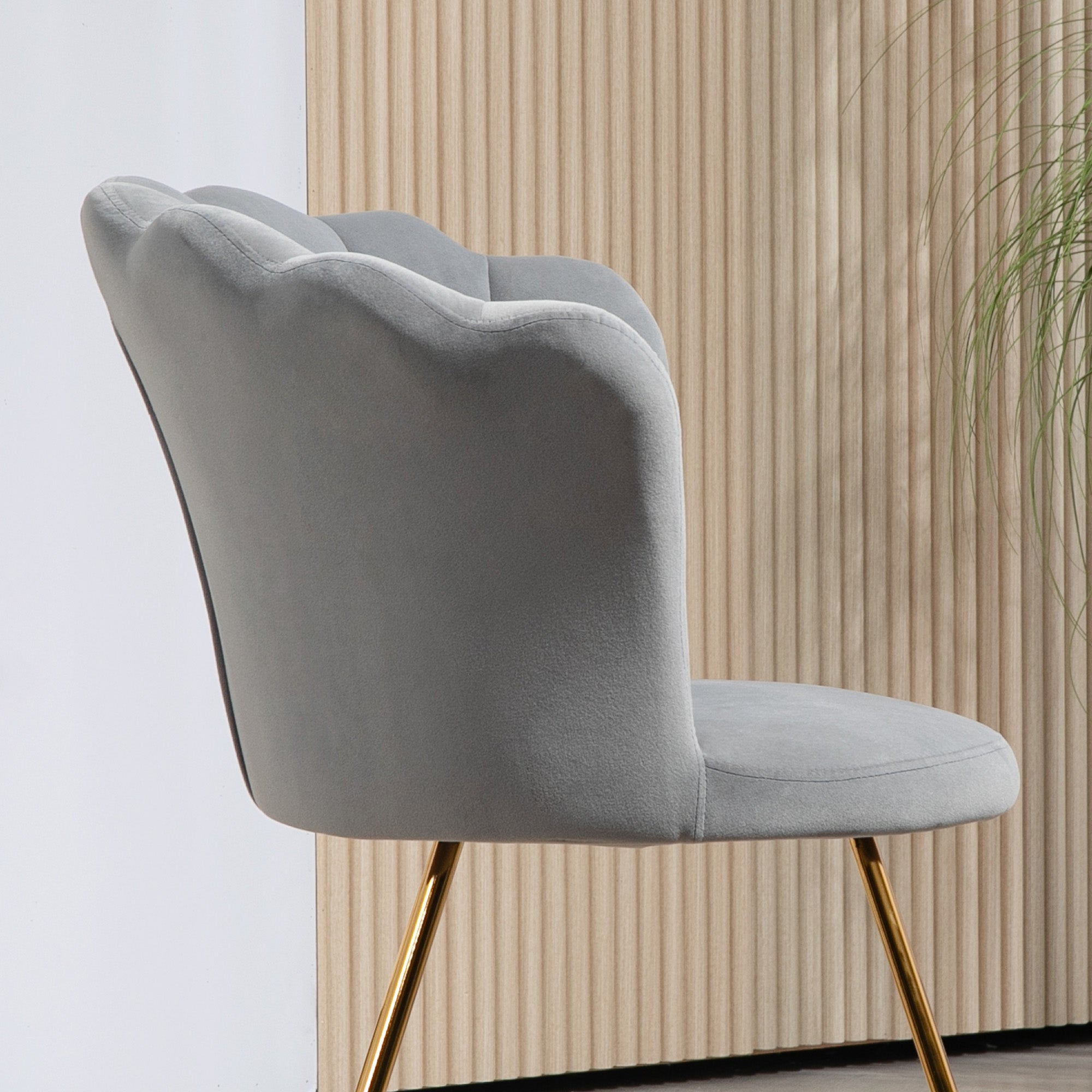 HOMCOM velvet accent chair with scalloped lotus-backrest, grey upholstery, and gold legs.