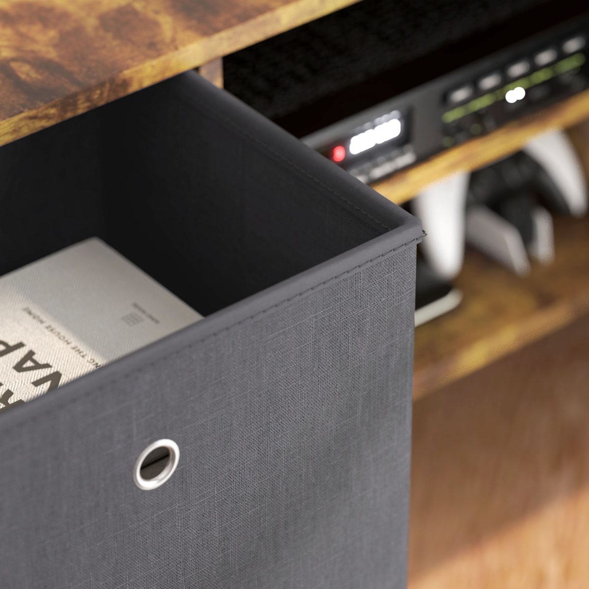 Grey fabric drawer pulled out from a HOMCOM TV cabinet with wood finish; top supports a TV, with media gear visible.