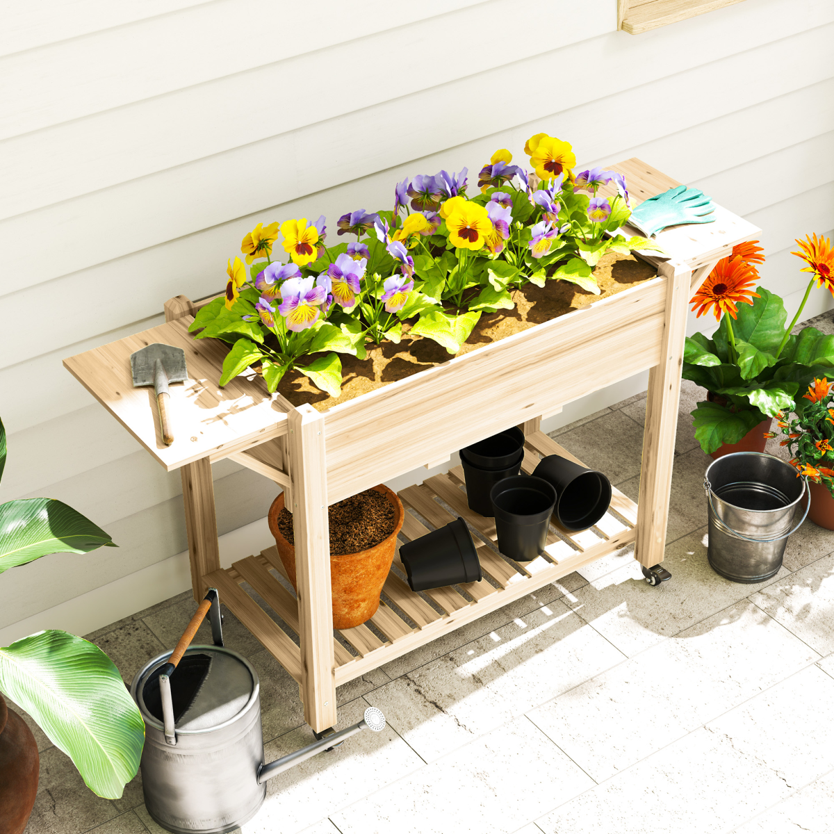 Outsunny wooden raised planter on lockable wheels with foldable ledges and shelf, filled with colorful flowers.