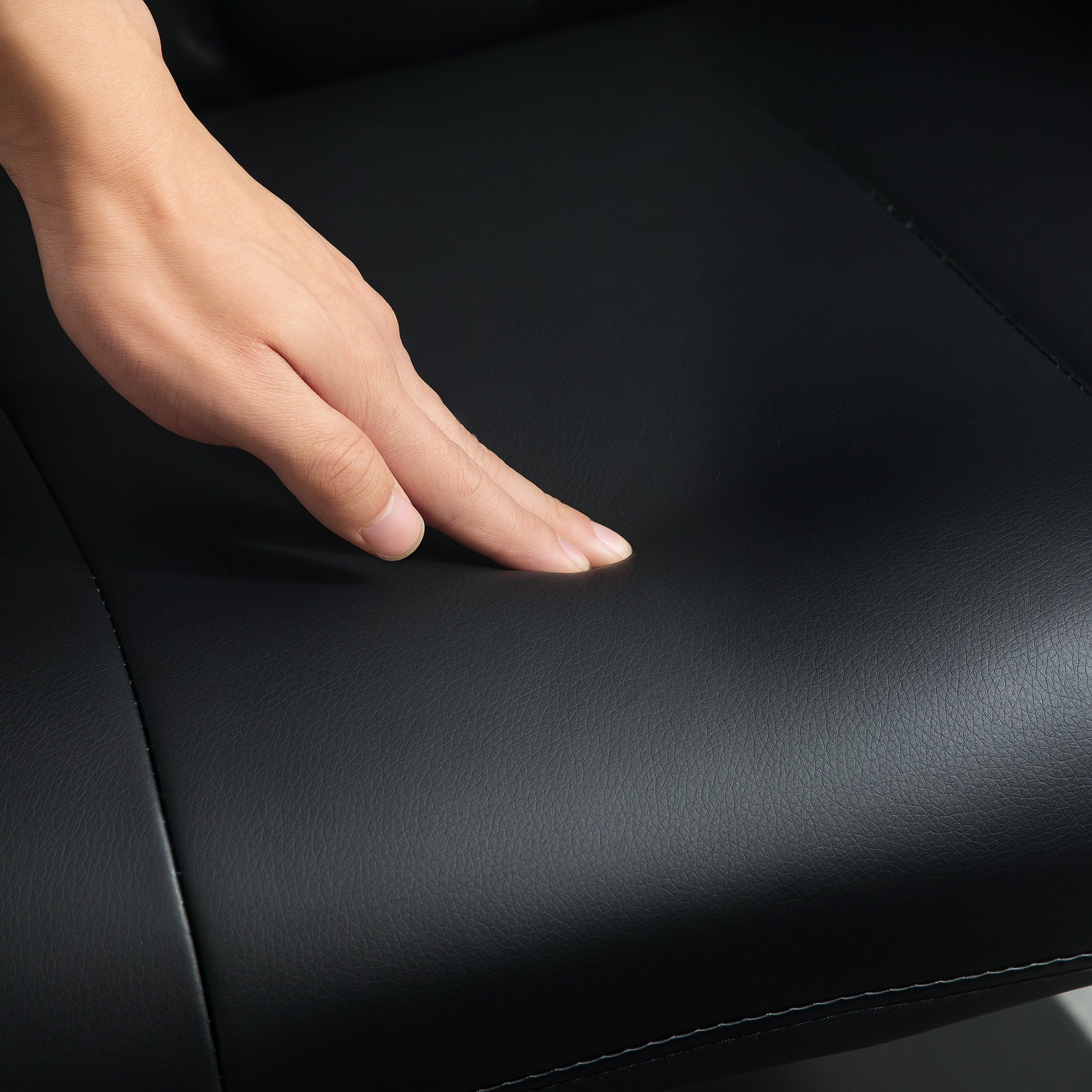 Comfort Plus Reclining Armchair Stool 360 Swivel Living Room Home Symphony black leather seat cushion showing padding.