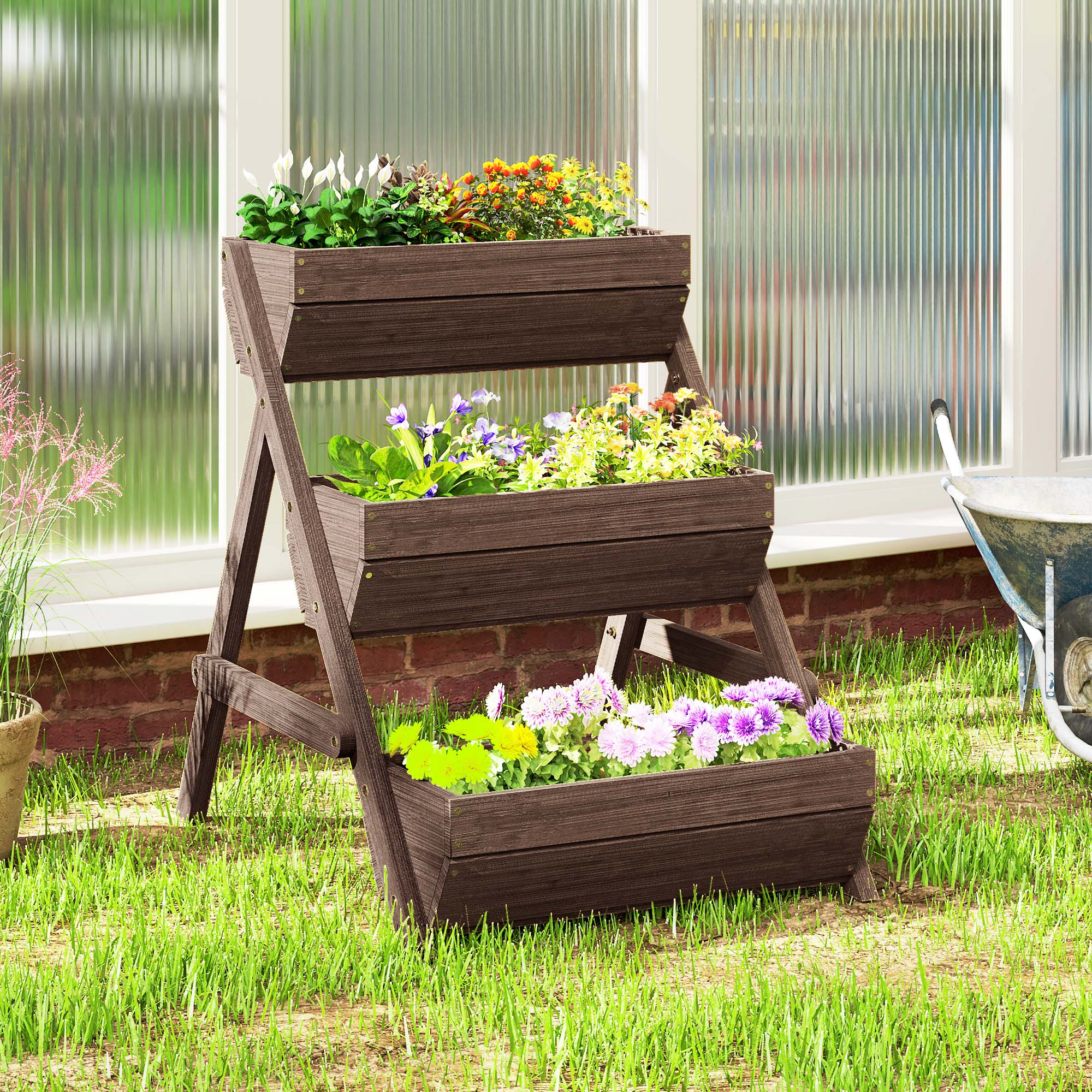 Premium 3-tier tan wood garden planter on a wooden stand, overflowing with colorful flowers on a patio.