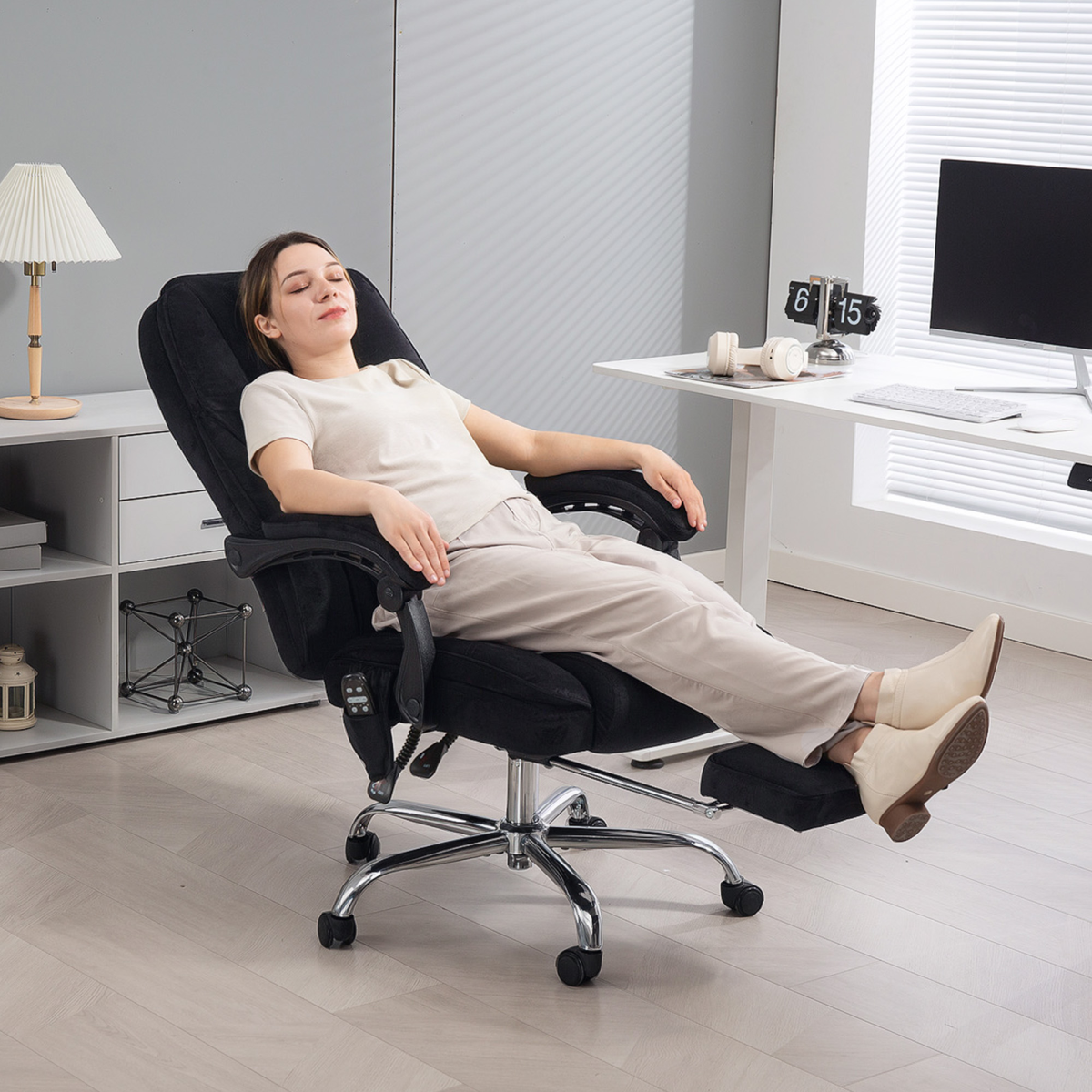 Vinsetto Massage Office Chair Six Point Massage For Desk user relaxing in a black massage chair at a modern desk