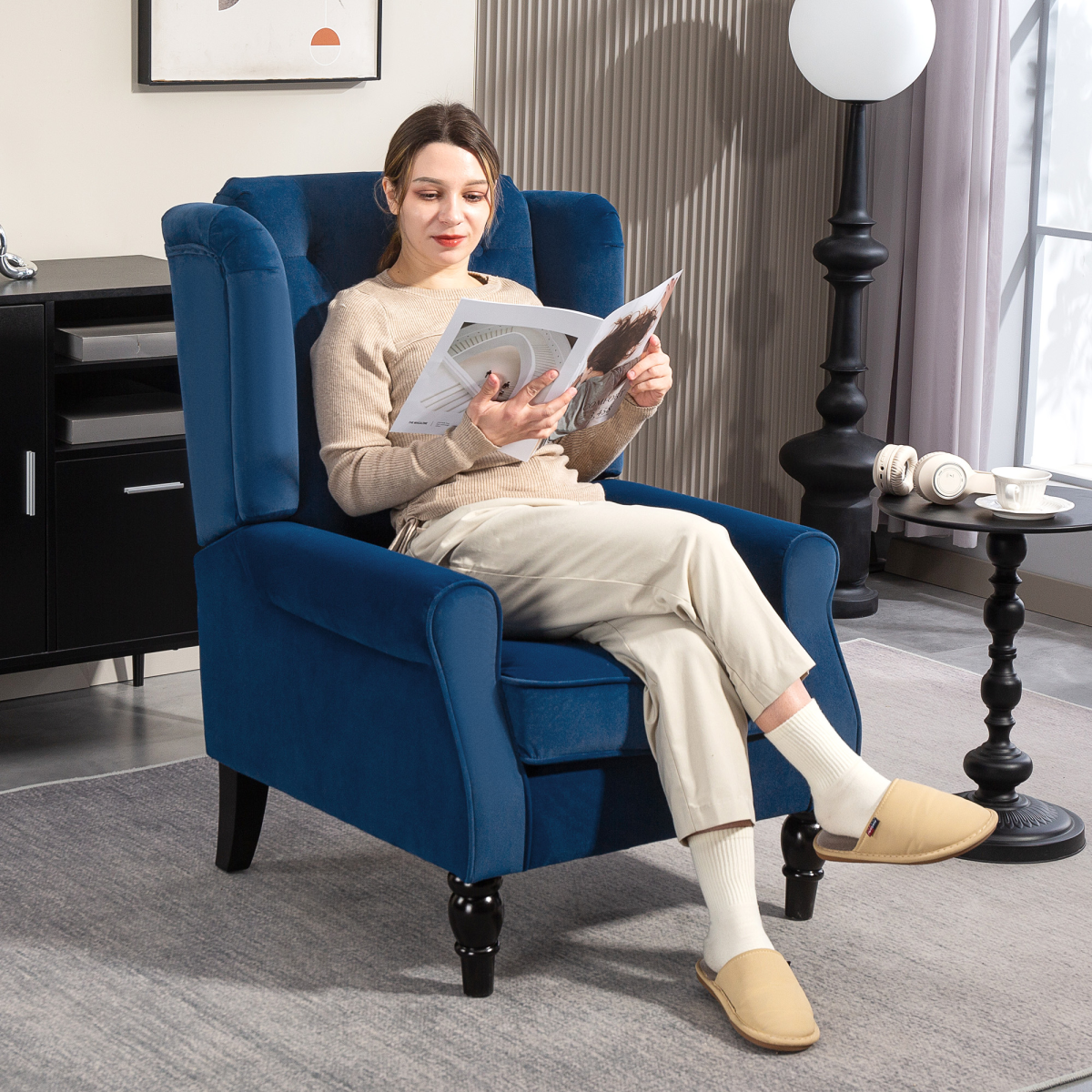 HOMCOM Wingback Accent Chair Tufted Retro Upholstery in blue with a person reading in a living room.