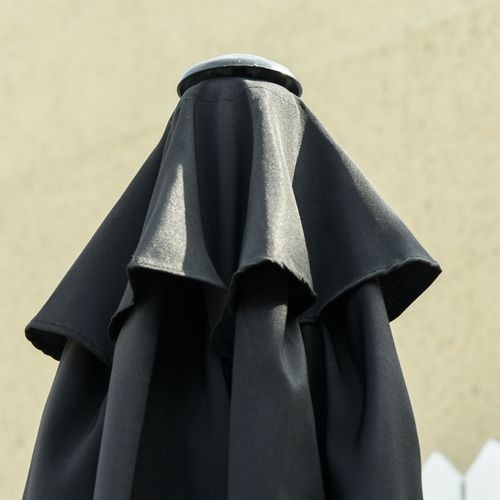 Stylish Outsunny 2.7M Patio Tilt Umbrella with Aluminium Frame and Crank for Outdoor Sun Protection in black design.