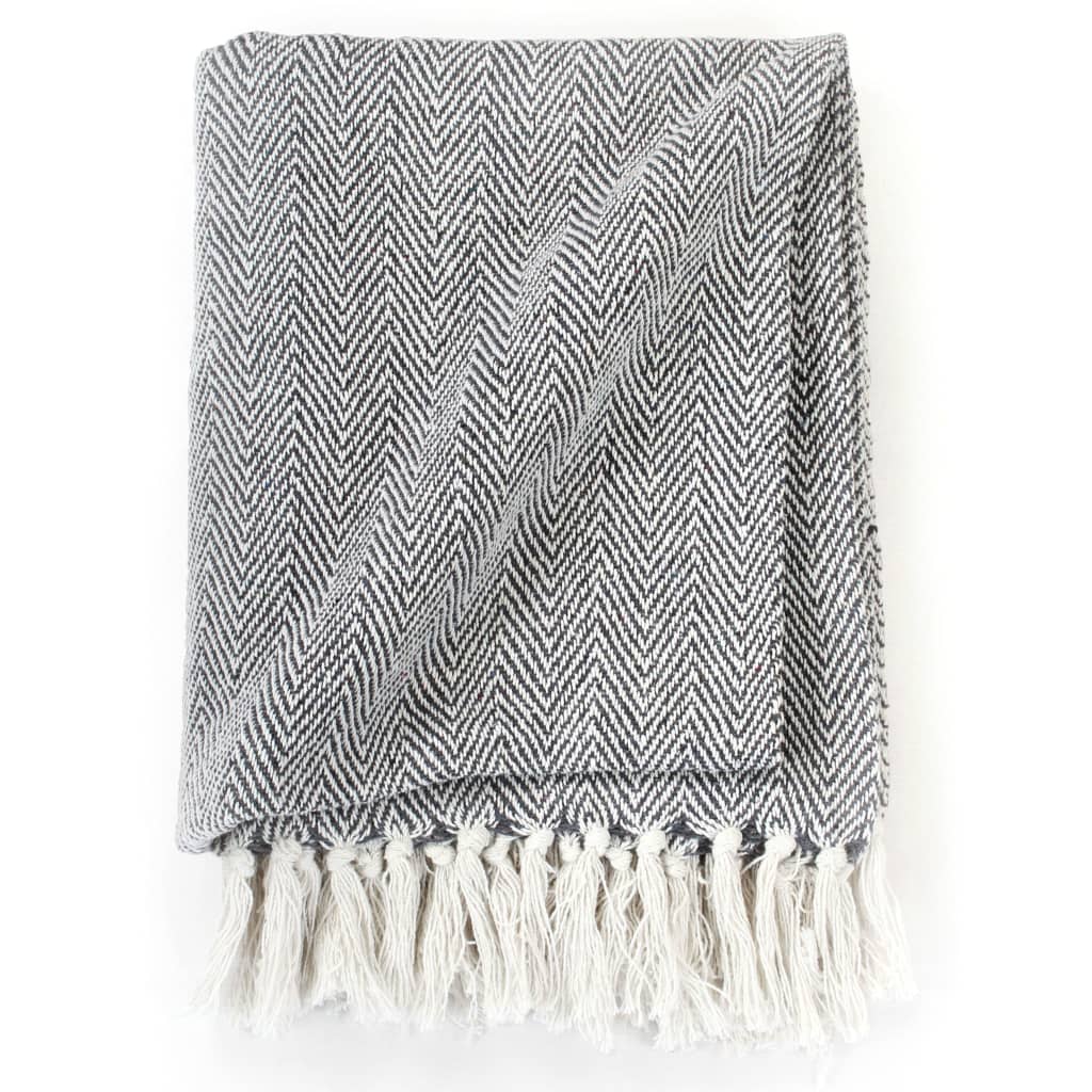 Soft vidaXL Throw Cotton Herringbone 125x150 cm Grey with trendy design and tassels, perfect for adding warmth to interiors.