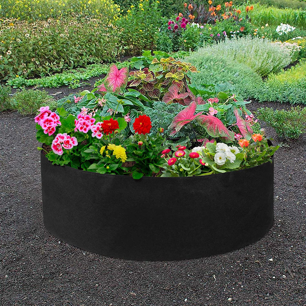 Durable grow bag, 70 cm diameter and 30 cm high, breathable and versatile for patio or balcony gardening with flowers.