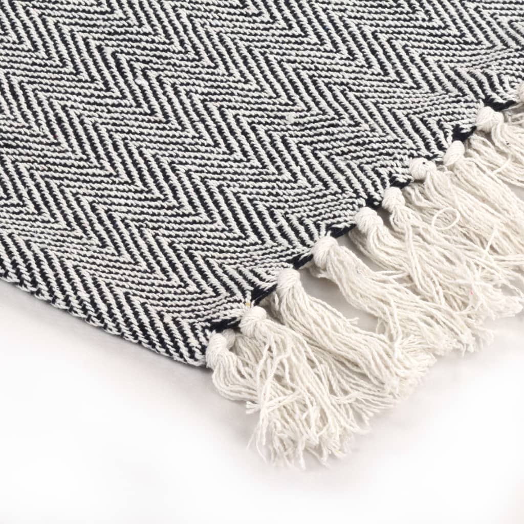 Soft vidaXL Throw Cotton Herringbone 125x150 cm Grey with trendy design and tassels, perfect for adding warmth to your space.