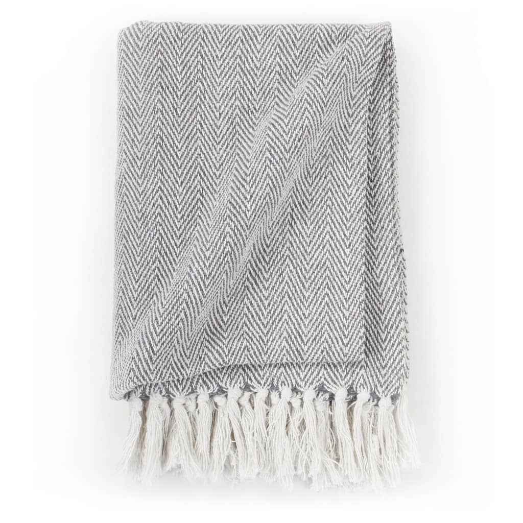 Cozy vidaXL Throw Cotton Herringbone 125x150 cm Grey with trendy design and tassels, perfect for any interior setting.