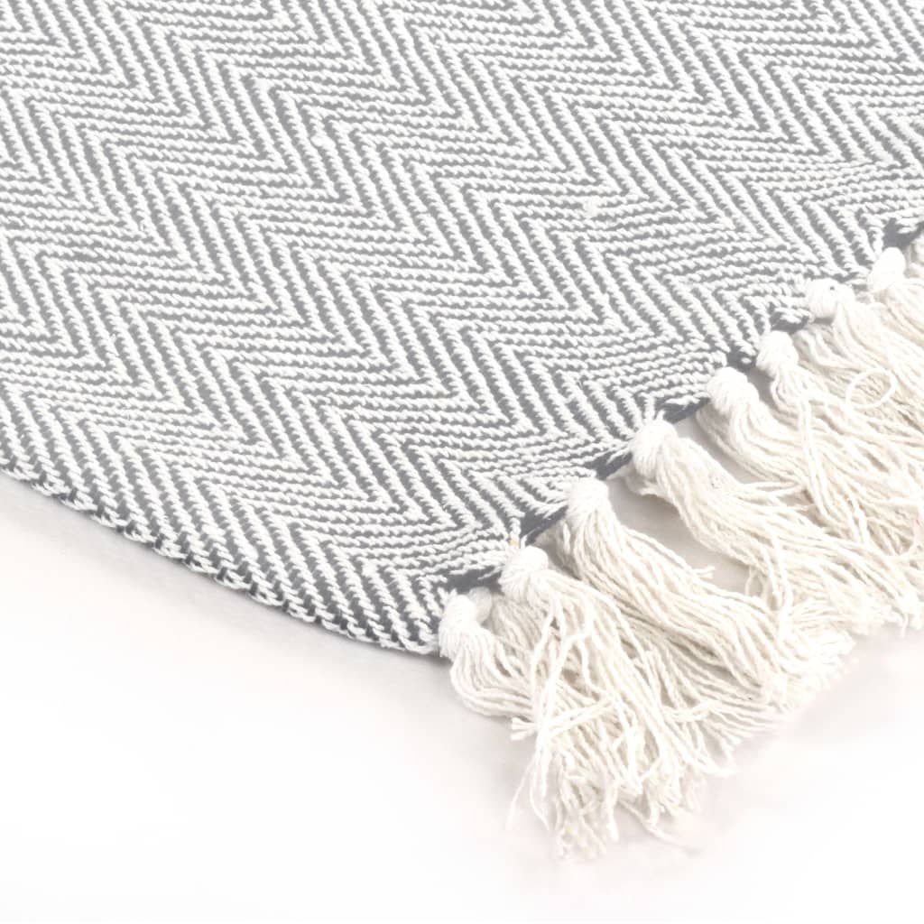 Cozy vidaXL Throw Cotton Herringbone 125x150 cm Grey with soft texture and trendy tassels, perfect for any space.