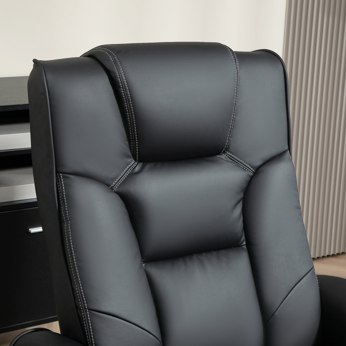 HOMCOM Reclining Armchair With Footstool For Living Room in black leather with contrast white stitching.