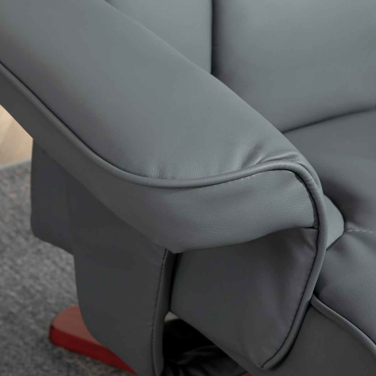 HOMCOM Reclining Armchair With Footstool For Living Room close-up of grey leather armrest.