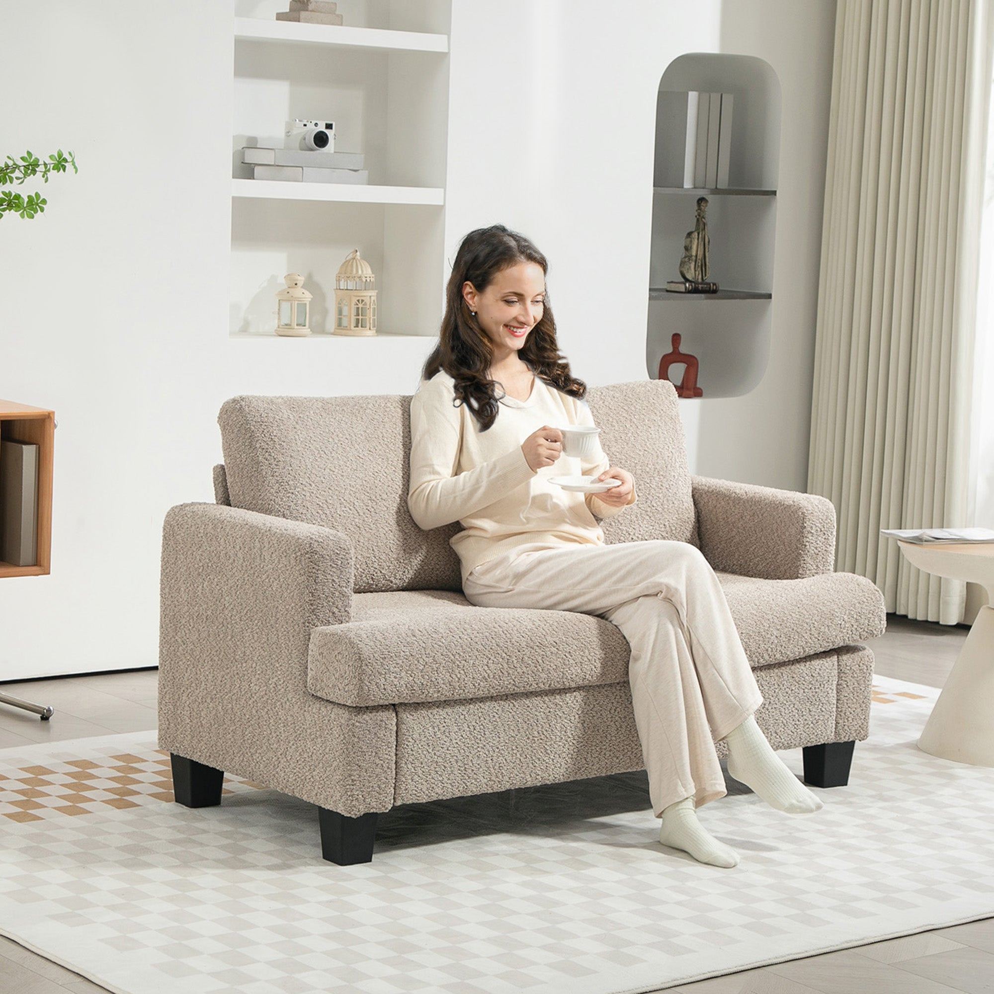 Homcom Chenille Loveseat 138 cm S Springs For Small Rooms chenille loveseat with a woman enjoying tea in a cozy room.