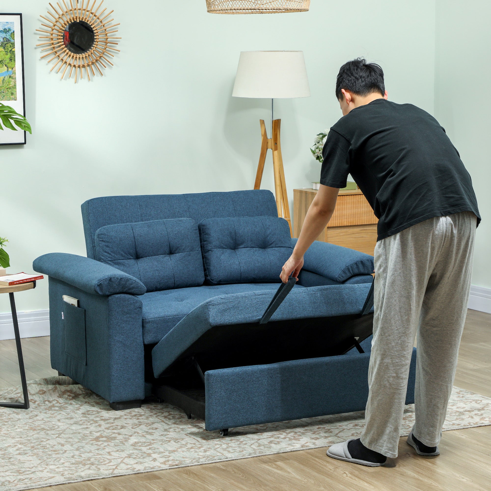 Homcom Sofa Bed Two Seater Click Clack For Living Room in blue fabric, being unfolded in a living room.