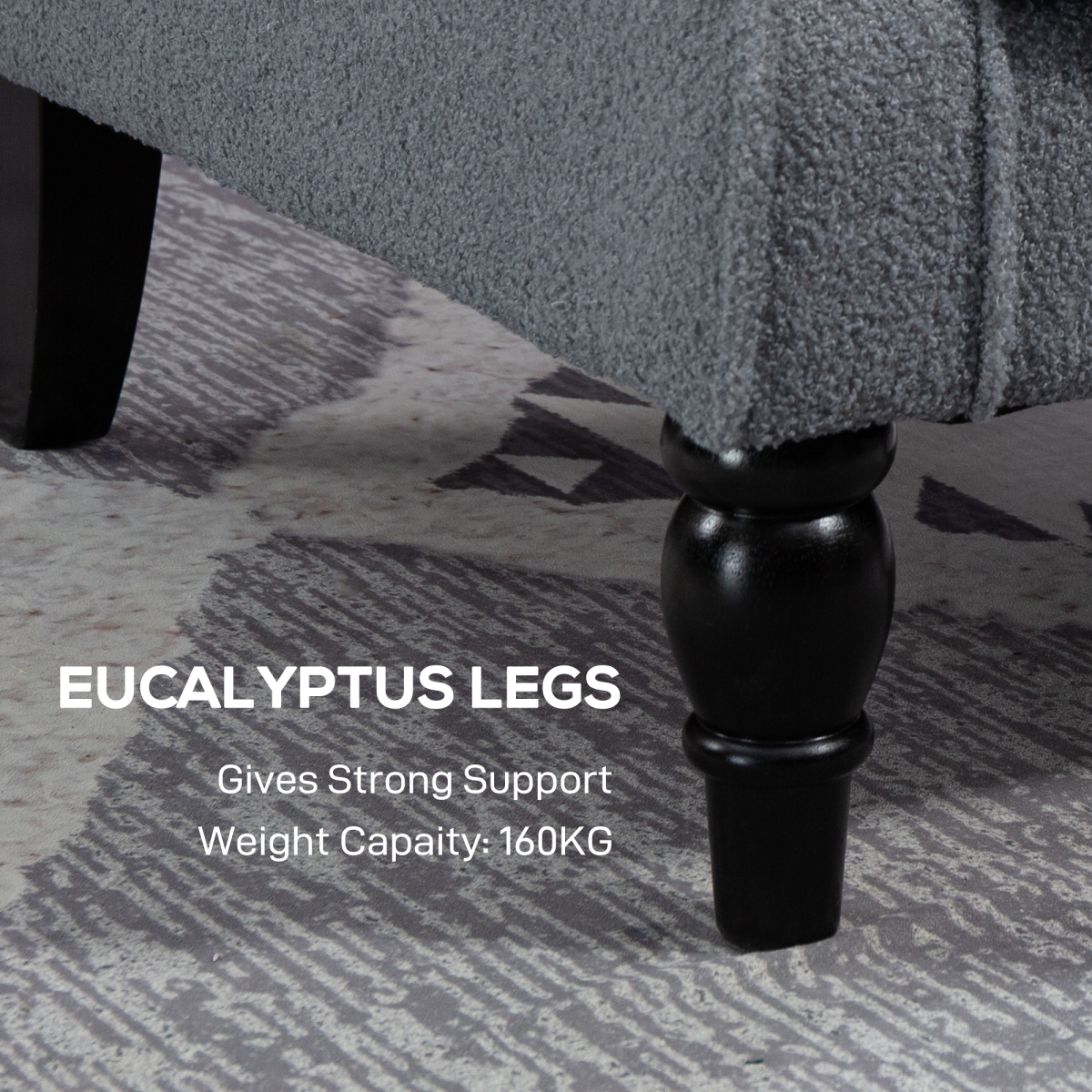 HOMCOM Wingback Accent Chair Tufted Retro Upholstery close-up of a black turned leg under grey tufted fabric.