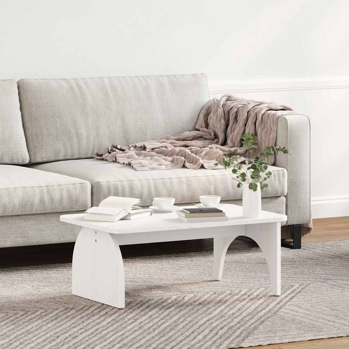 VidaXL Coffee Table 80 x 50 x 31 cm Natural Pine Living Room white coffee table with curved legs beside a sofa on a rug.