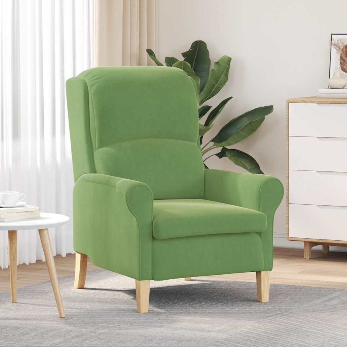 Green velvet armchair with high back and rounded arms, light wood legs in a bright living room.