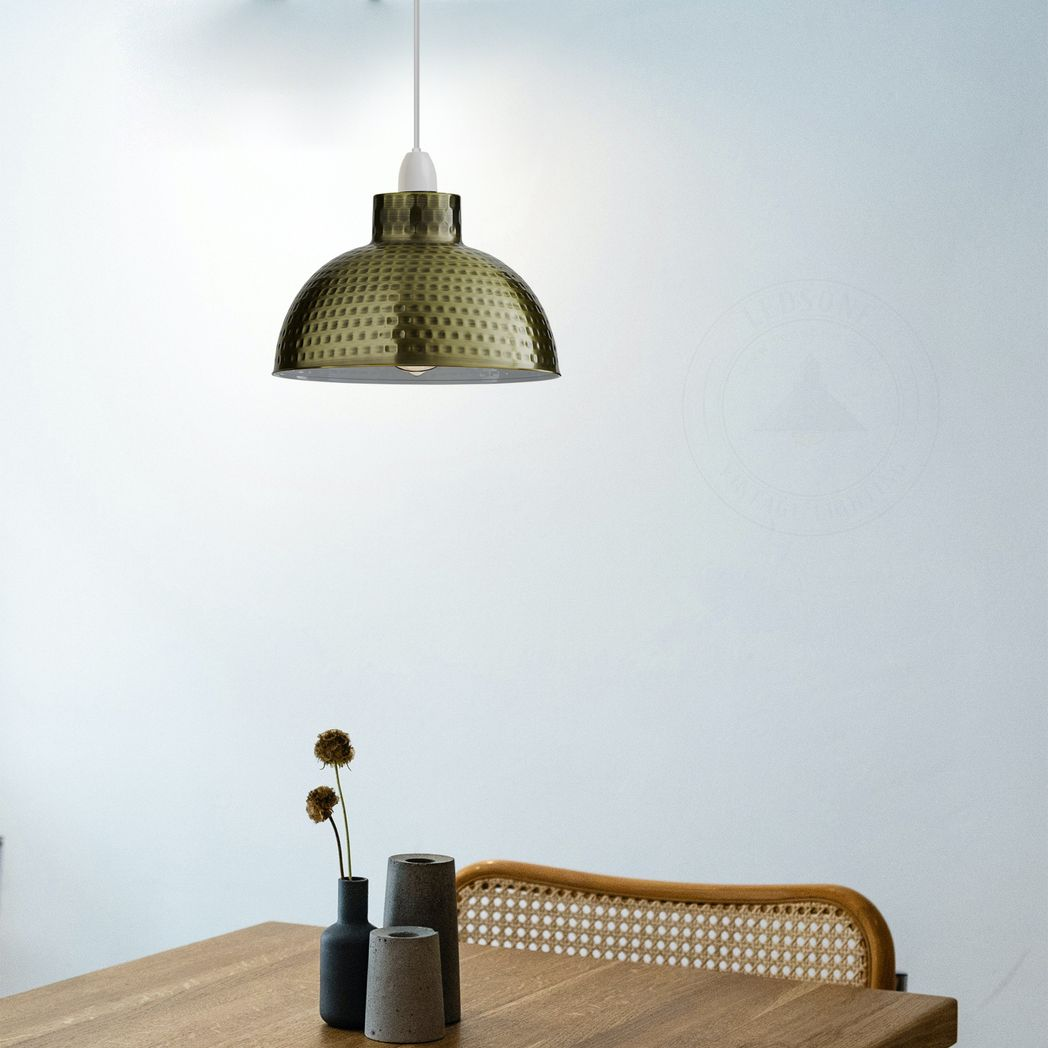 Green Brass Dome Lamp Shade 26cm Easy Fit Home Decor by Home Symphony hanging above a wooden table.