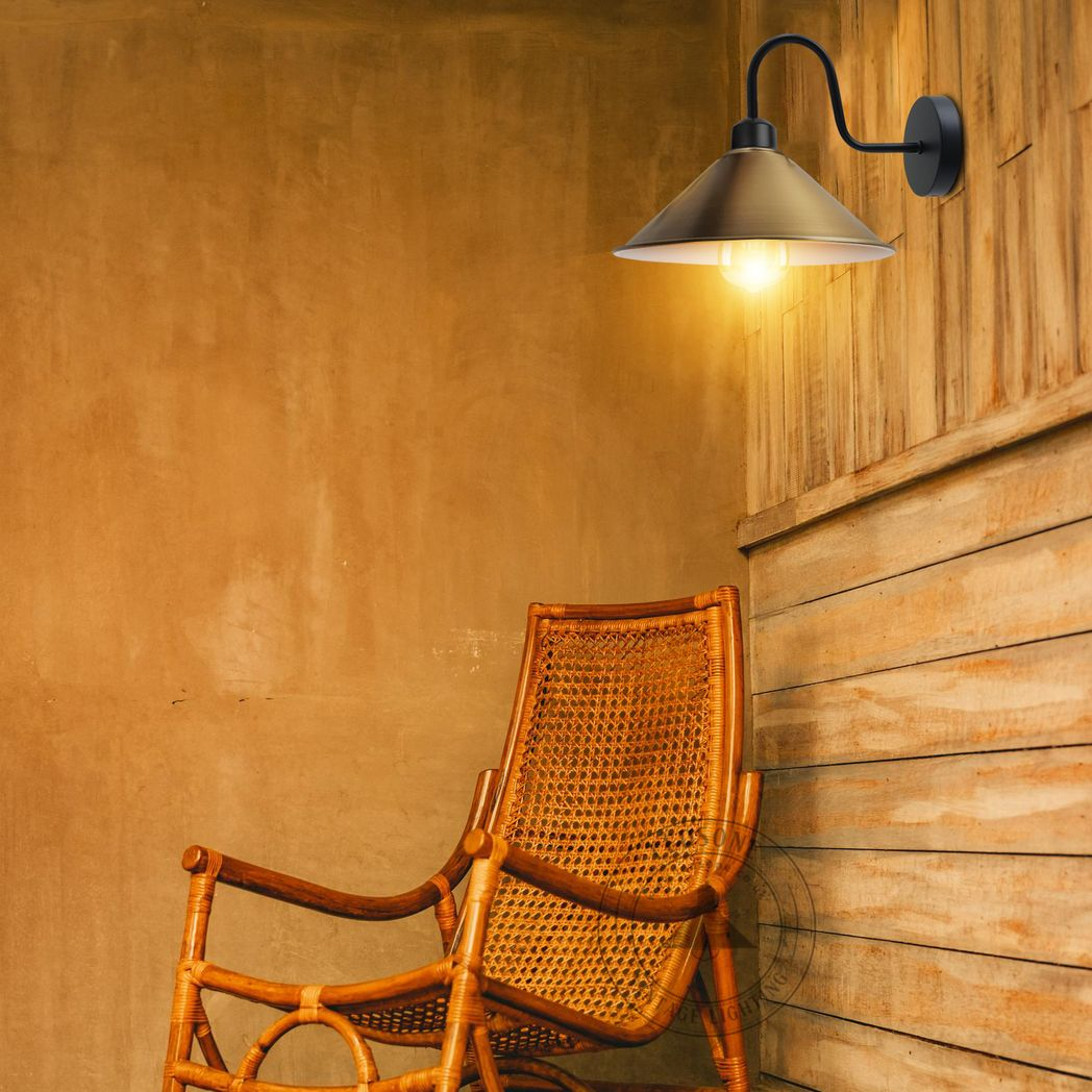 Premium Wall Light 8in Cone Shade Swan Neck Home Decor with warm glow above a wicker chair.