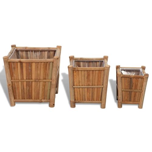 Stylish 3 pcs Bamboo Raised Bed with Nylon Lining, perfect for enhancing your garden or patio with vibrant plants.